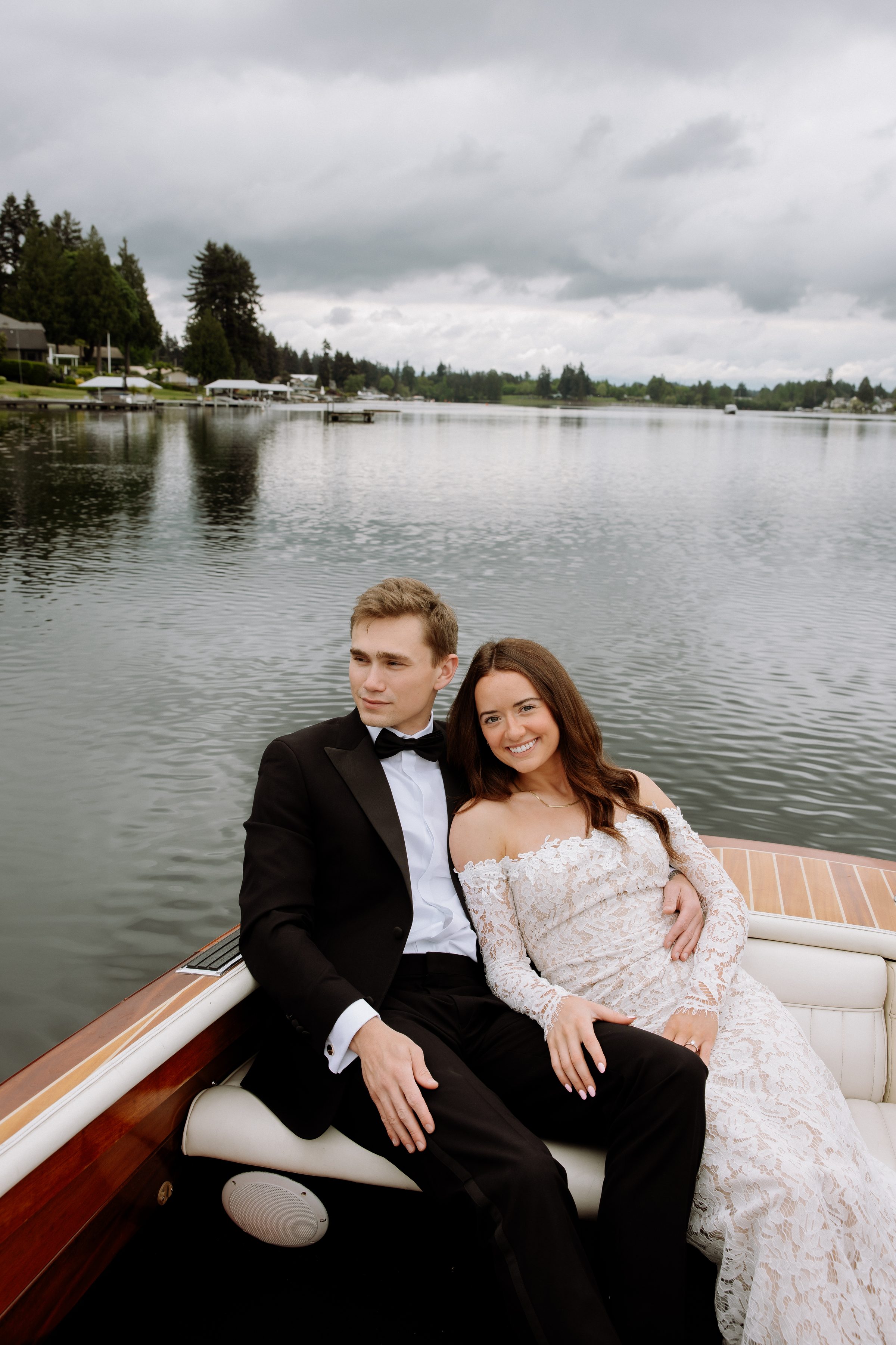Duncan and Addison embracing on a wooden boat