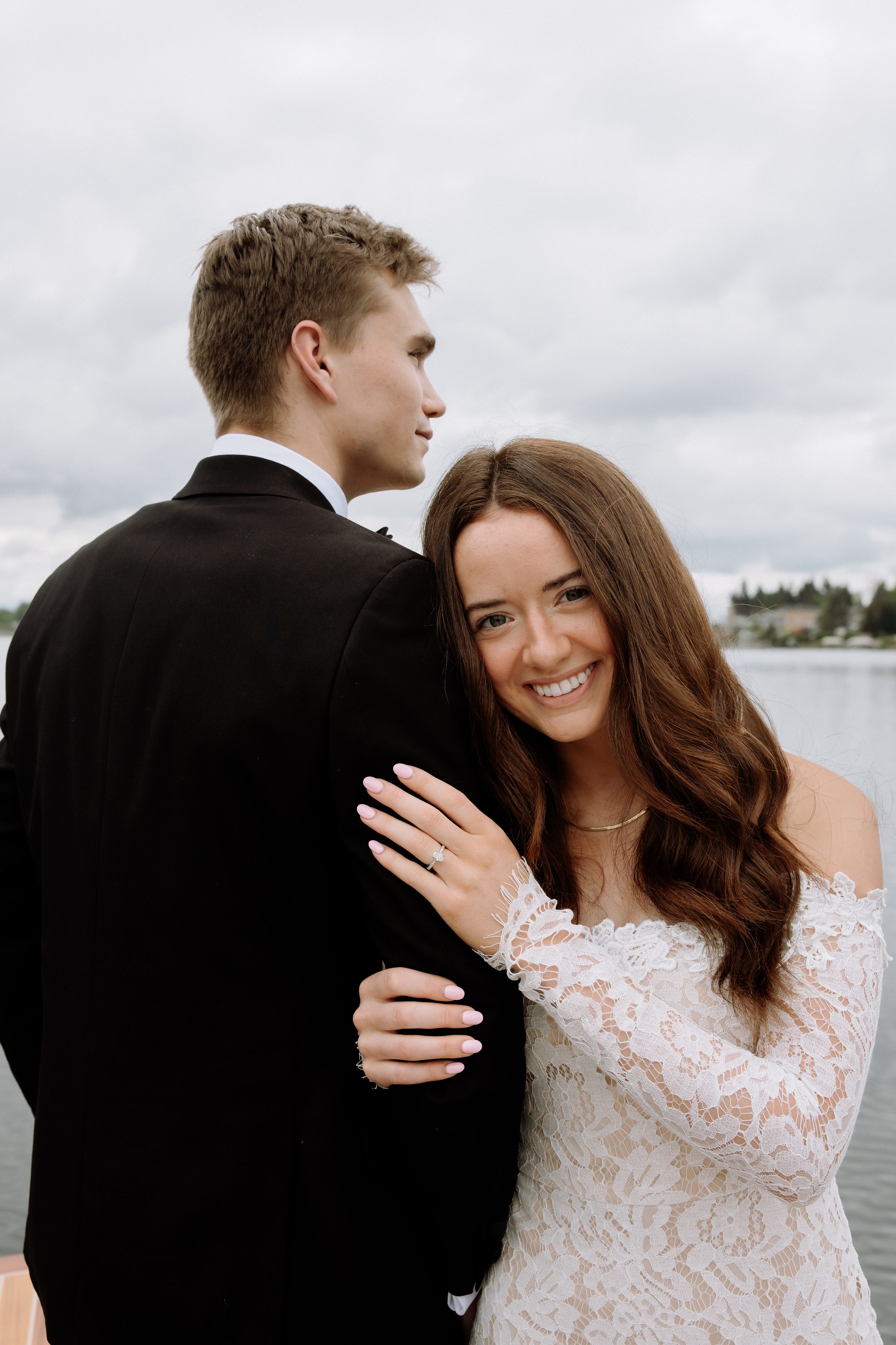 Addison and Duncan close together by the water